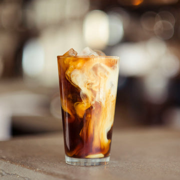 Willow and Bloom Coffee's fresh medium roast coffee beans in a full cup of flavor